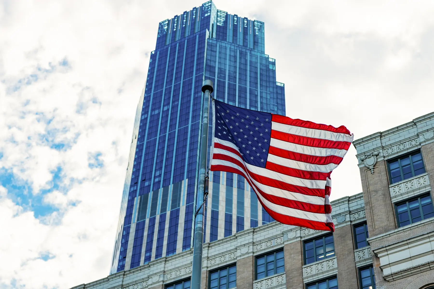 A large building with us flag infront of it